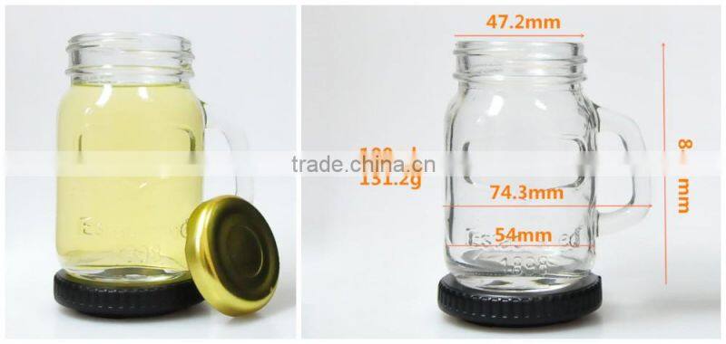 Clear embossed glass mason jar with gold metal lid