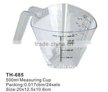 plastic measuring cup with spoons