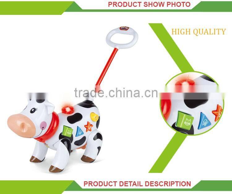 Funny hand push battery operated musical cow walking animal toys