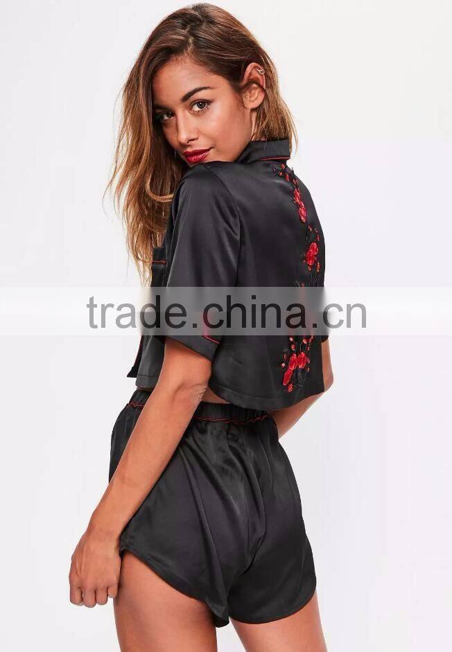 Black Satin Pyjamas Set Button Fastening Fit Crop Shirt With Piping Back Floral Applique And Elasticated Shorts
