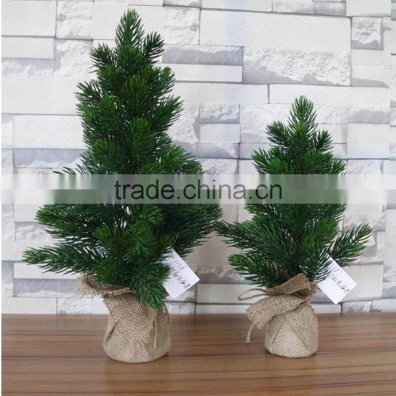 Plastic mini pine tree with burlap base for table decoration