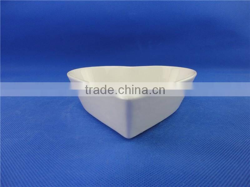 white ceramic heart shaped bowl