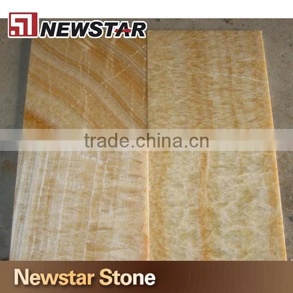Backlit transparent honey yellow onyx marble tiles