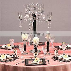 black candelabra with flower bowl