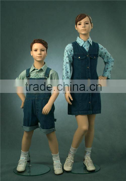 Christmas window display dress up realistic children mannequins