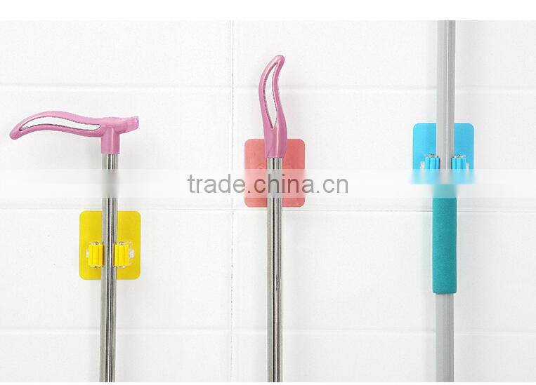 Wholesale Stock Magic Wall Suction Plastic Mop Handle Storage Holder