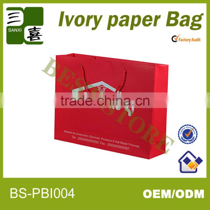 red printed paper gift carry bag with ribbon