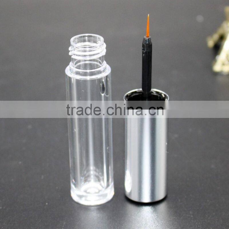 Empty eyeliner container with metallic cap for cosmetic use