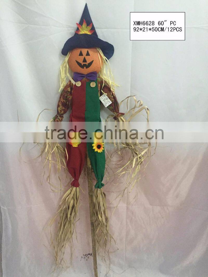 Straw and fabric scarecrow witch for halloween decoration