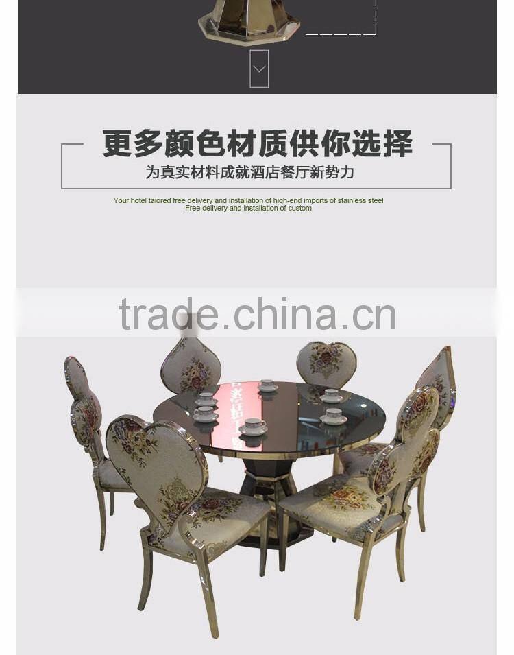 Upholstered stainless steel goldedn glass surface table for sale