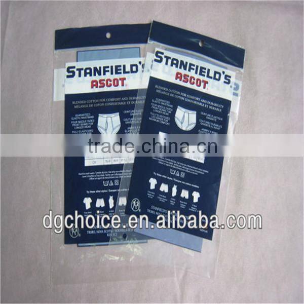 Plastic header bag with hole and lip on the bottom