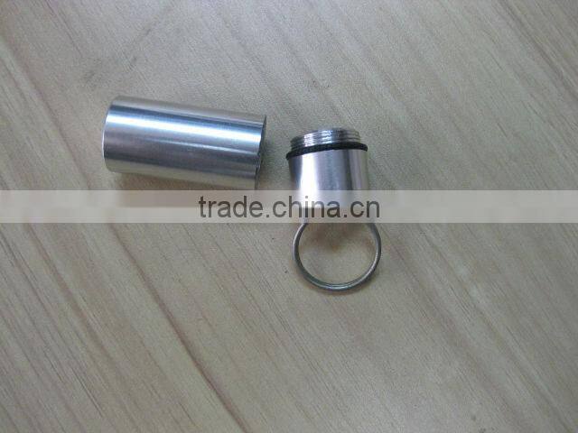 pill holder keychain with a pen