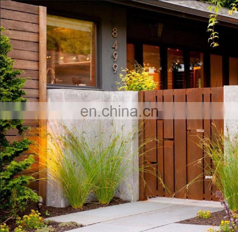 Laser cut corten steel garden gates with black powder coated posts