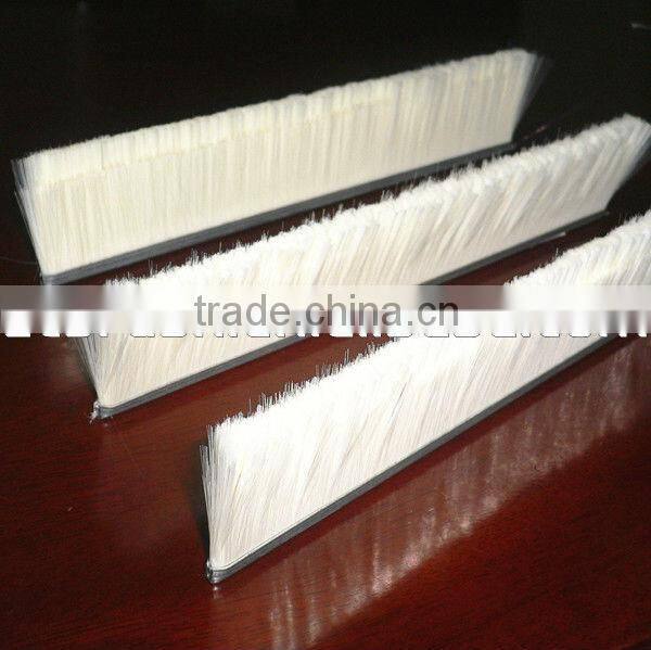 Metal channel flexible strip brush