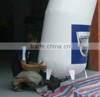 white inflatable arch with black words