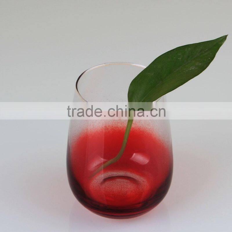 Red bottom stemless wine glass