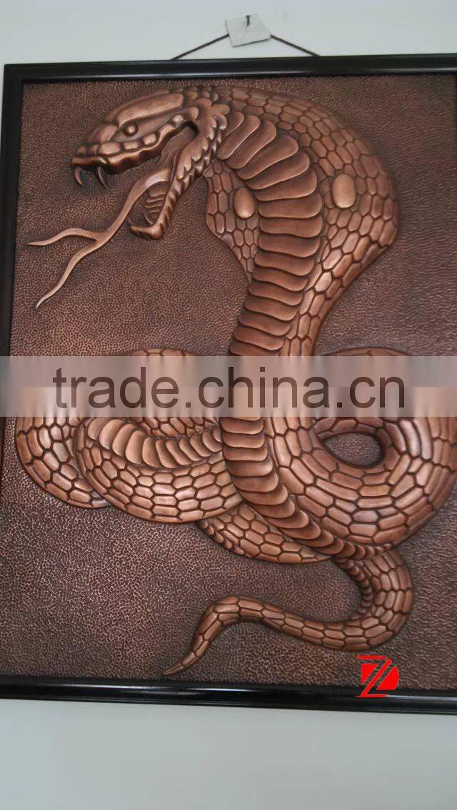 large snake sculpture wall relief