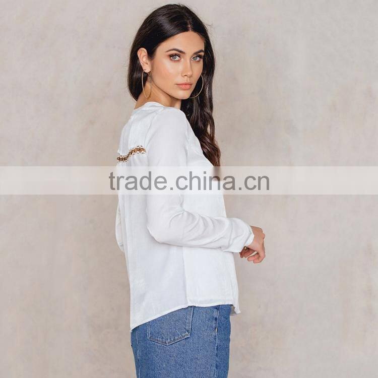 HAODUOYI Fashion White Women Blouse Cross Lace-up Bead Deep V-neck Hollow Out Sexy Long Sleeve Female Top for Wholesale