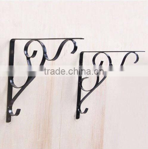 A Pair of Vintage Wrought Iron Architectural Wall Hanging Basket Brackets