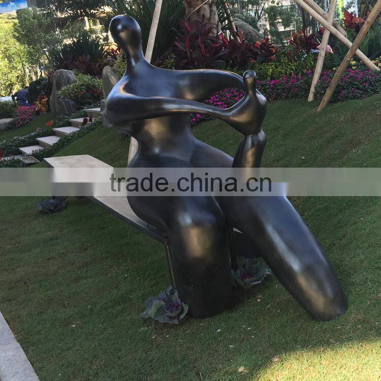 Fiberglass man character on bench