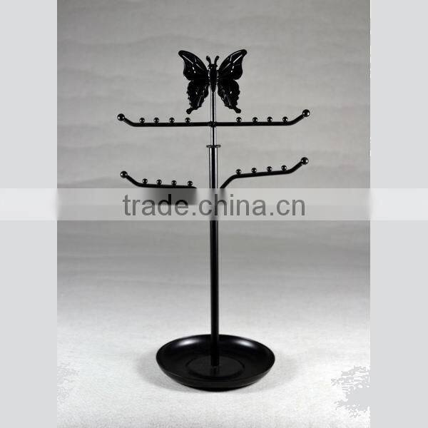 Metal jewelry display with butterfly on the top
