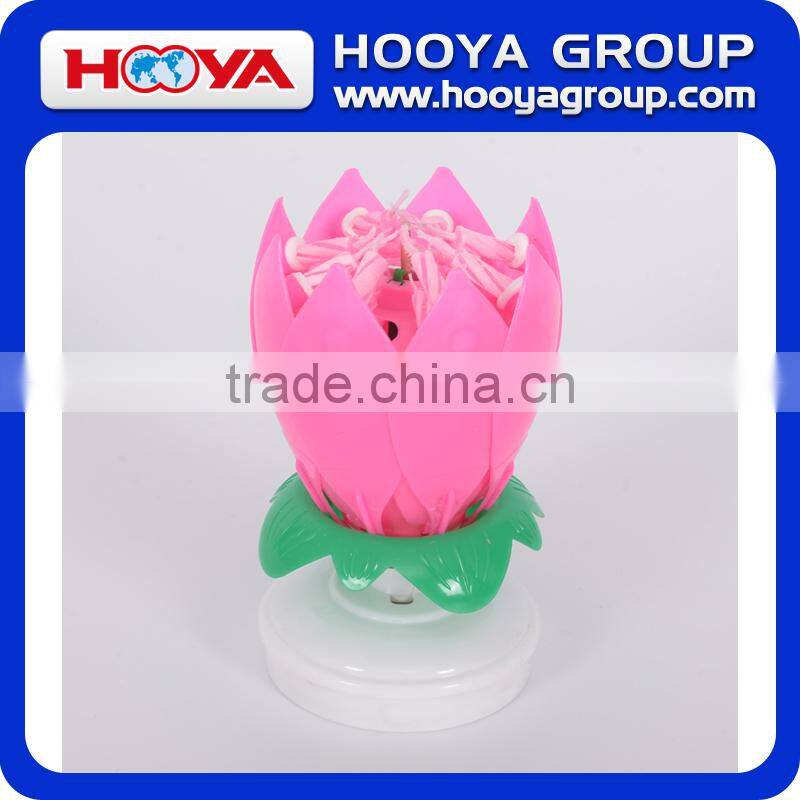 Lotus shaped rotating birthday candle with round base