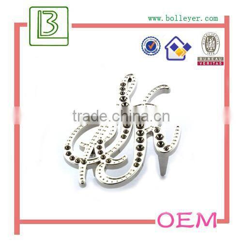 metal oval shaped logo patch