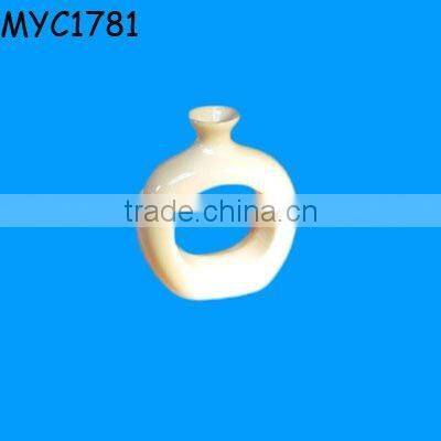 White ceramic napkin ring vase