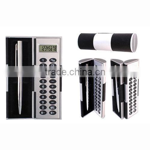 table calculator with the pen and paper