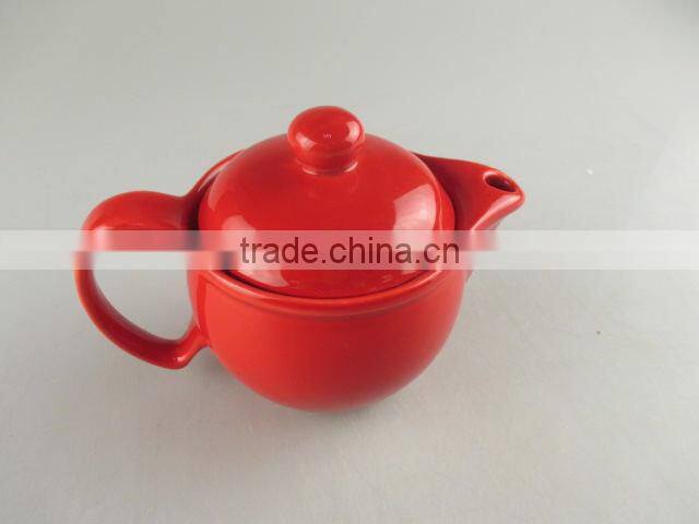 Glazed red round porcelain teapot in stock