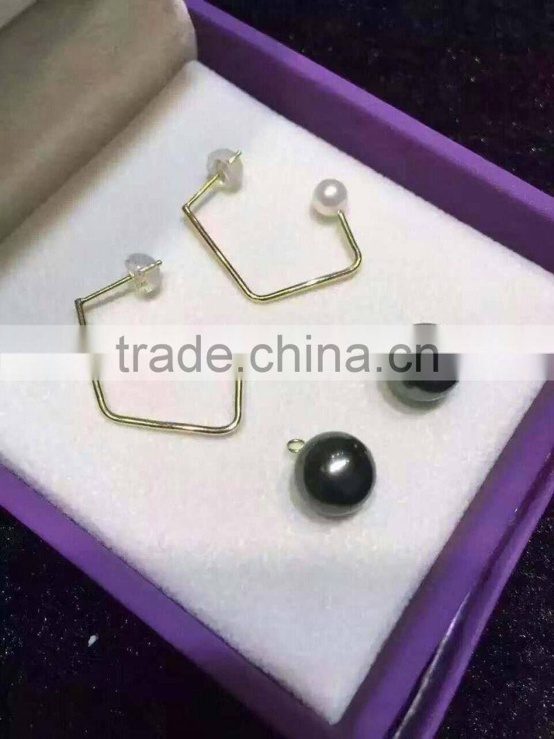 4.5-5mm white Akoya pearl earrings with 12mm black Tahitian pearl earring