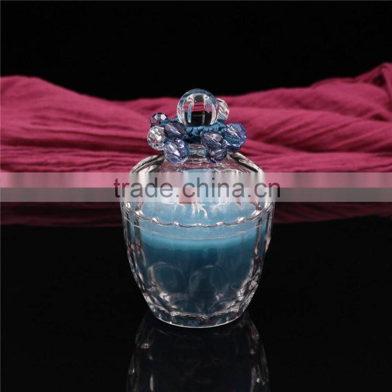 christmas colorful soy or paraffin wax scented candles in glass jars