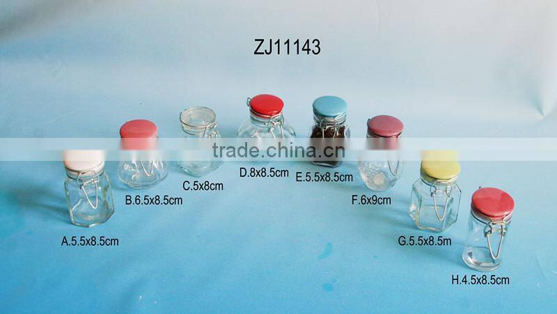 glass spice jar with colored ceramic folding top lid