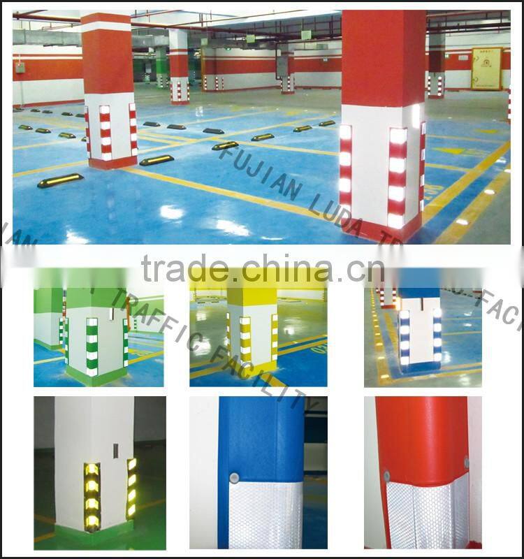 Colored wall corner protector for parking lot