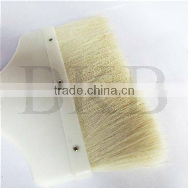 wool paint brush with plastic handle