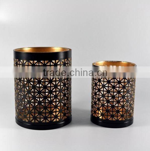 Golden cylinder candle holder