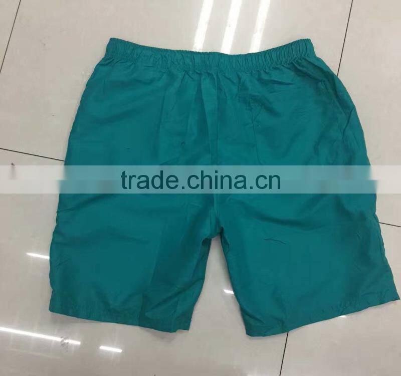 China stocklots men 100%polyester pure color bermuda shorts