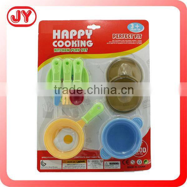 Children playing plastic toy vegetables with EN71