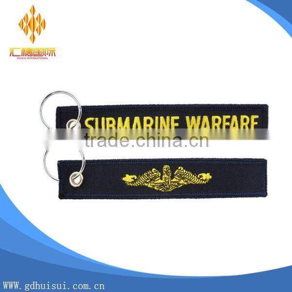 Popular design cheap customized elliptical shape embroidery personalized logo key chain