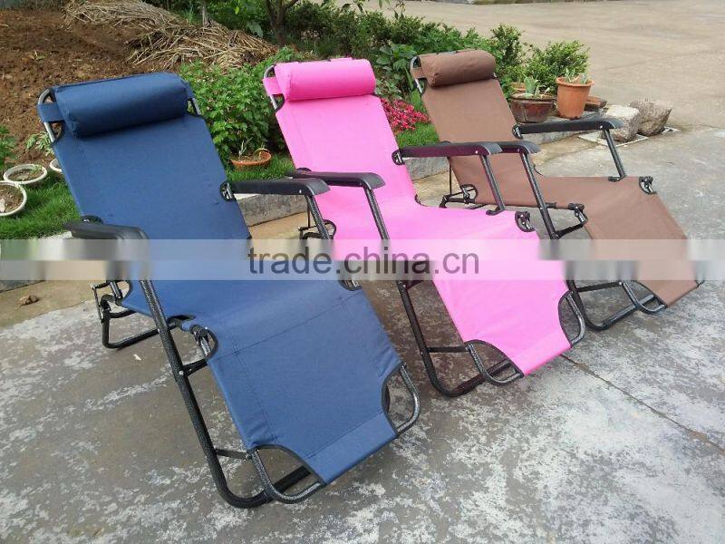 Folding lounge with foot rest and pillow