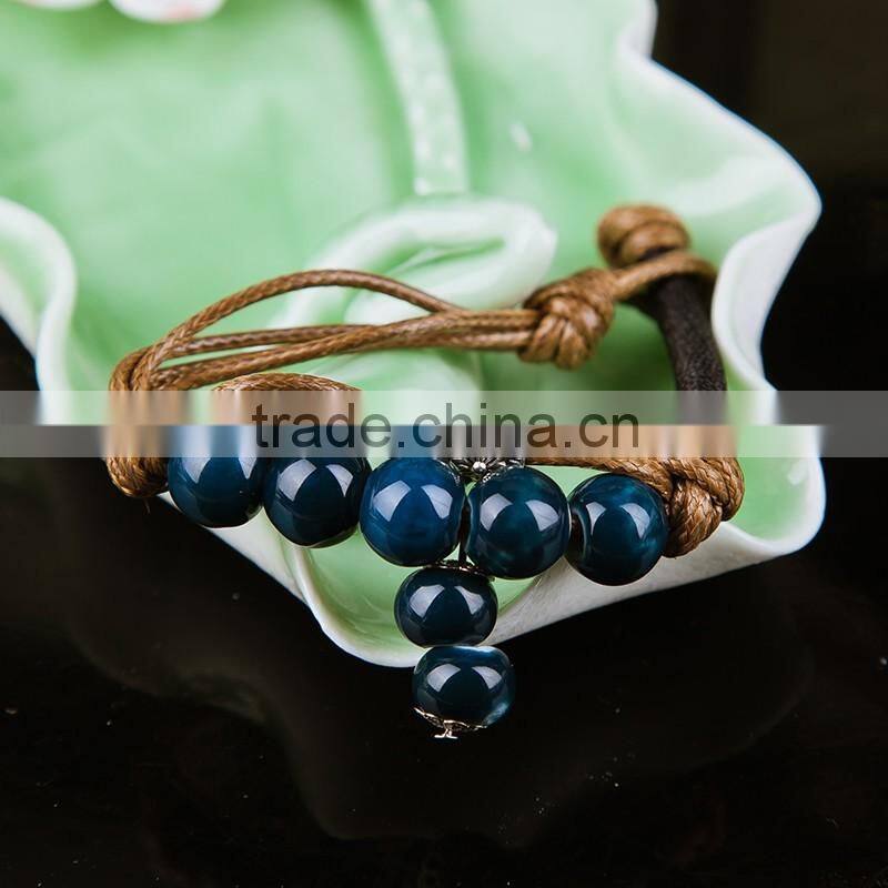 Retro Chinese Red Handmade leather Ceramic bead bracelet with bell on it