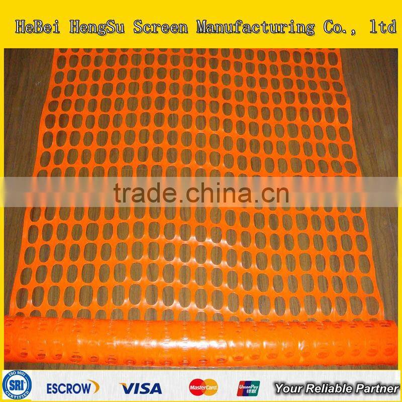 Red temporary warning mesh fence