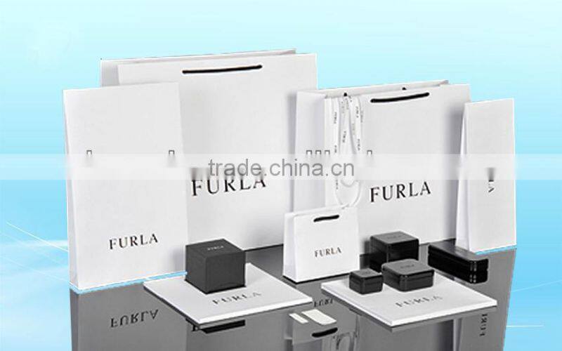 Red shopping paper bags with satin handle