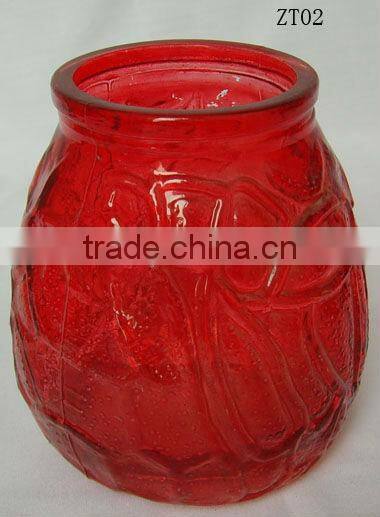 red glass candle holder with pattern design