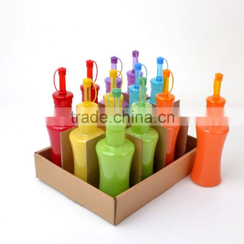 colored glass olive oil and vinegar bottle