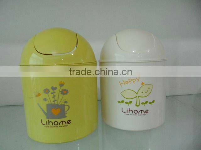 Round swing-top plastic trash can