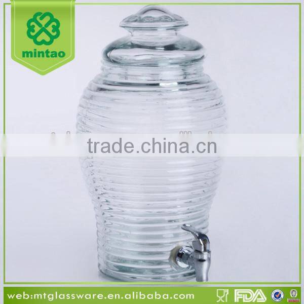 Clear machine made glass dispenser for juice beverage water with silver tap