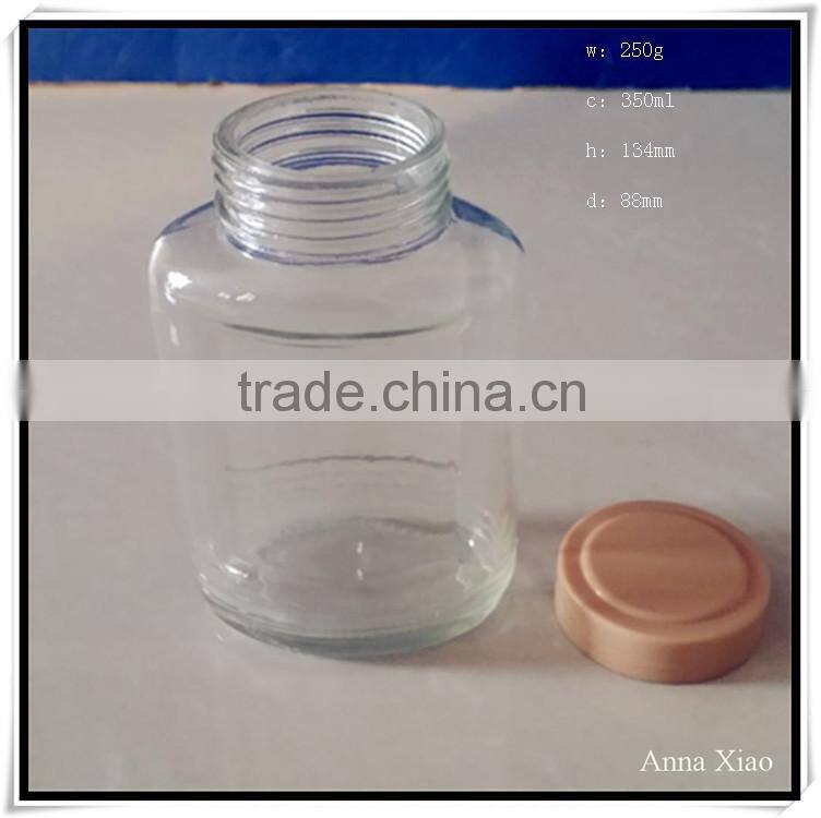 China made 350ml glass honey jars with plastic caps