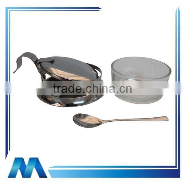 stainless steel sugar bowl and spoon with glass body