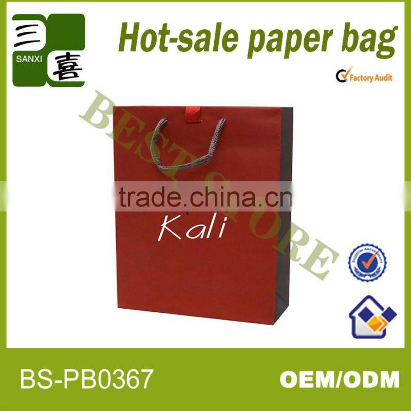 red printed paper gift carry bag with ribbon